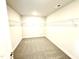 Walk-in closet with carpeted floors and metal shelving at 356 Bishop Ln, Sanford, NC 27330