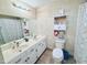 Bathroom featuring double vanity, cabinet storage, and decorative accents at 3605 Mine Creek Rd, Burlington, NC 27217