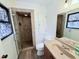 Bathroom with large shower, decorative tile work, and a dark wood-style vanity at 3605 Mine Creek Rd, Burlington, NC 27217