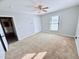 Spacious bedroom with a ceiling fan and closet, featuring neutral carpet at 3605 Mine Creek Rd, Burlington, NC 27217