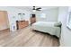 Cozy bedroom with light wood floors, ceiling fan, and a matching dresser set at 3605 Mine Creek Rd, Burlington, NC 27217