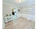 Inviting dining room with decorative wainscotting and modern light wood grain flooring at 3605 Mine Creek Rd, Burlington, NC 27217
