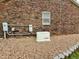 Brick exterior with a backup generator and gravel landscaping for easy maintenance at 3605 Mine Creek Rd, Burlington, NC 27217