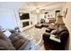 Comfortable living room with brick fireplace, large sectional sofa, and built-in shelving at 3605 Mine Creek Rd, Burlington, NC 27217