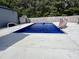 Inviting in-ground pool with a slide and concrete surround, perfect for summer enjoyment at 3605 Mine Creek Rd, Burlington, NC 27217