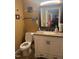 Bathroom featuring neutral colors, a framed mirror, and a vanity with storage at 432 N Mercer N St, Rocky Mount, NC 27801