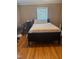 Bedroom with hardwood floors and a queen bed at 432 N Mercer N St, Rocky Mount, NC 27801