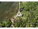 A charming countryside home surrounded by verdant trees and a long, private driveway at 435 Salt And Light Ln, Henderson, NC 27537
