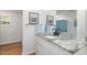 Bathroom featuring a white vanity with a gray and white marble countertop, and black fixtures at 435 Salt And Light Ln, Henderson, NC 27537
