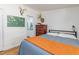 Bedroom features a cozy bed, hardwood floors, wood dresser and mounted deer head at 435 Salt And Light Ln, Henderson, NC 27537