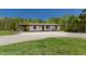 Inviting home with a covered porch and relaxing rocking chairs, perfect for enjoying the outdoors at 435 Salt And Light Ln, Henderson, NC 27537