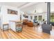 Comfortable living room featuring wood floors, a fireplace, and leather furniture at 435 Salt And Light Ln, Henderson, NC 27537