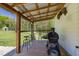 Outdoor deck with bar seating and a grill, perfect for entertaining and enjoying outdoor cooking at 435 Salt And Light Ln, Henderson, NC 27537