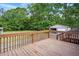 A wood deck overlooks the grass backyard and detached garage at 4467 Virgilina Rd, Roxboro, NC 27574