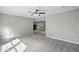 Spacious living room showcasing neutral colors, carpet, and seamless flow into the kitchen area at 4467 Virgilina Rd, Roxboro, NC 27574