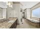 Beautiful bathroom features double vanity, a tub, and a separate glass shower at 5009 Coe Hill Pl, Cary, NC 27519