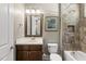 Bathroom featuring tub, tile surround, and vanity at 5009 Coe Hill Pl, Cary, NC 27519