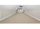 Large bonus room with neutral carpeting, recessed lighting and dormer ceiling at 5009 Coe Hill Pl, Cary, NC 27519