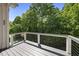 Deck with view of the wooded backyard at 5009 Coe Hill Pl, Cary, NC 27519