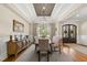 Elegant dining room boasts coffered ceilings and natural light at 5009 Coe Hill Pl, Cary, NC 27519