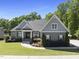Beautiful single-Gathering home featuring manicured lawn and landscaping at 5009 Coe Hill Pl, Cary, NC 27519