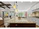 Lovely island kitchen featuring granite counters, an island, and hardwood floors at 5009 Coe Hill Pl, Cary, NC 27519