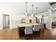 Bright, open kitchen with a large center island and modern appliances at 5009 Coe Hill Pl, Cary, NC 27519