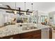 Gourmet kitchen featuring a large island and seamless flow into the living area at 5009 Coe Hill Pl, Cary, NC 27519