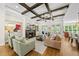 Bright living room featuring coffered ceilings, fireplace, and built-in shelving at 5009 Coe Hill Pl, Cary, NC 27519