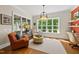 Inviting living room with natural light, hardwood floors, and a cozy seating area at 5009 Coe Hill Pl, Cary, NC 27519