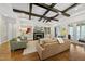 Inviting living room with a fireplace and coffered ceiling at 5009 Coe Hill Pl, Cary, NC 27519