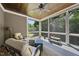 Inviting screened porch with comfortable seating and a ceiling fan at 5009 Coe Hill Pl, Cary, NC 27519