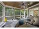 Relaxing screened porch with ample seating, ceiling fan, and wooded views at 5009 Coe Hill Pl, Cary, NC 27519