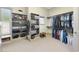 Large walk-in closet offering shelving and hanging areas for organized storage at 5009 Coe Hill Pl, Cary, NC 27519