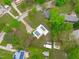 Expansive aerial view of home with solar panels, lush yard, and mature trees at 5144 Jeffries St, Raleigh, NC 27606