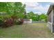 Spacious backyard featuring a shed, swing and lush green lawn at 5144 Jeffries St, Raleigh, NC 27606