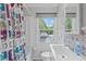Bathroom with decorative tiles, and a shower with window at 5144 Jeffries St, Raleigh, NC 27606