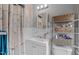 Bright bathroom showcasing storage shelves, a vanity with sink and an updated vanity mirror at 5144 Jeffries St, Raleigh, NC 27606