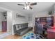 Cozy bedroom features a desk area, ceiling fan, and a comfortable couch at 5144 Jeffries St, Raleigh, NC 27606