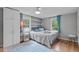 Tranquil bedroom featuring hardwood floors, and two large windows that provide plenty of light at 5144 Jeffries St, Raleigh, NC 27606