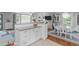 Bright dining area adjacent to the kitchen features a breakfast bar and hardwood floors at 5144 Jeffries St, Raleigh, NC 27606
