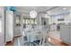 Open-concept dining area adjacent to kitchen featuring a view of the exterior deck at 5144 Jeffries St, Raleigh, NC 27606