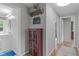 Inviting hallway featuring wood floors and access to a powder room at 5144 Jeffries St, Raleigh, NC 27606