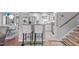 Modern kitchen with stainless steel appliances and breakfast bar connecting to the living area at 5144 Jeffries St, Raleigh, NC 27606