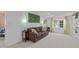 Cozy living room showcasing a comfortable sofa, decorative wall art, and lots of natural light at 5144 Jeffries St, Raleigh, NC 27606
