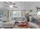 Bright living room with large windows, cozy seating, and stylish decor at 5144 Jeffries St, Raleigh, NC 27606
