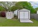 Backyard featuring two storage sheds, providing ample space for outdoor equipment and storage at 5144 Jeffries St, Raleigh, NC 27606