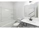 This bathroom features a shower-tub combo with a single sink vanity at 517 W Brocklyn St # 63P, Benson, NC 27504