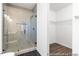 Bathroom with walk-in shower with tile and dual shower heads, and a walk-in closet at 517 W Brocklyn St # 63P, Benson, NC 27504