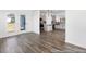 Open-concept living room showcasing hardwood floors and view into the modern kitchen at 517 W Brocklyn St # 63P, Benson, NC 27504